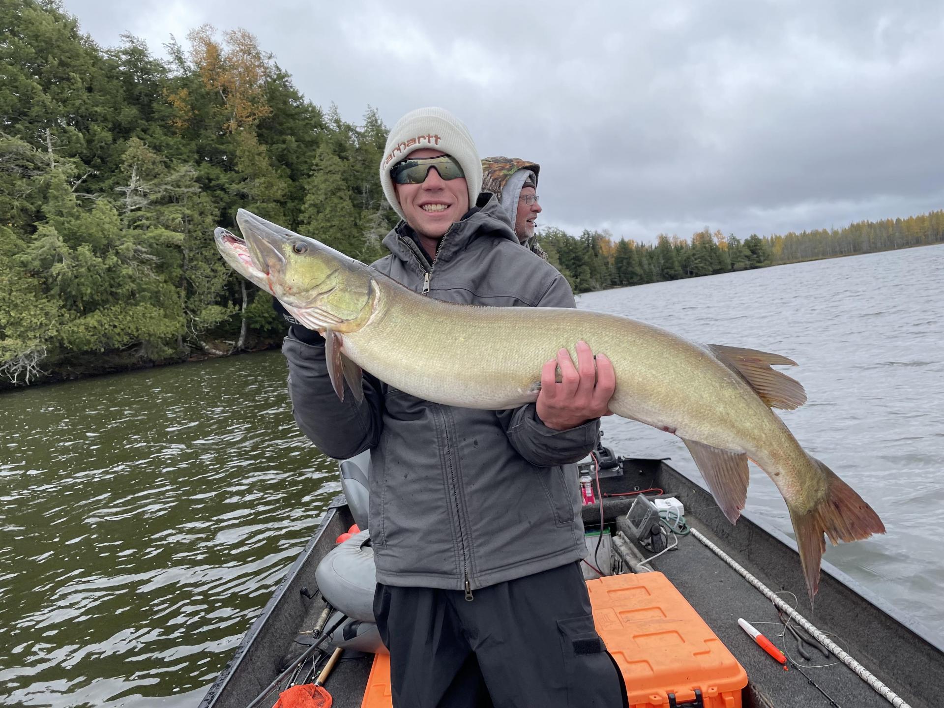 Man holding a large Musky