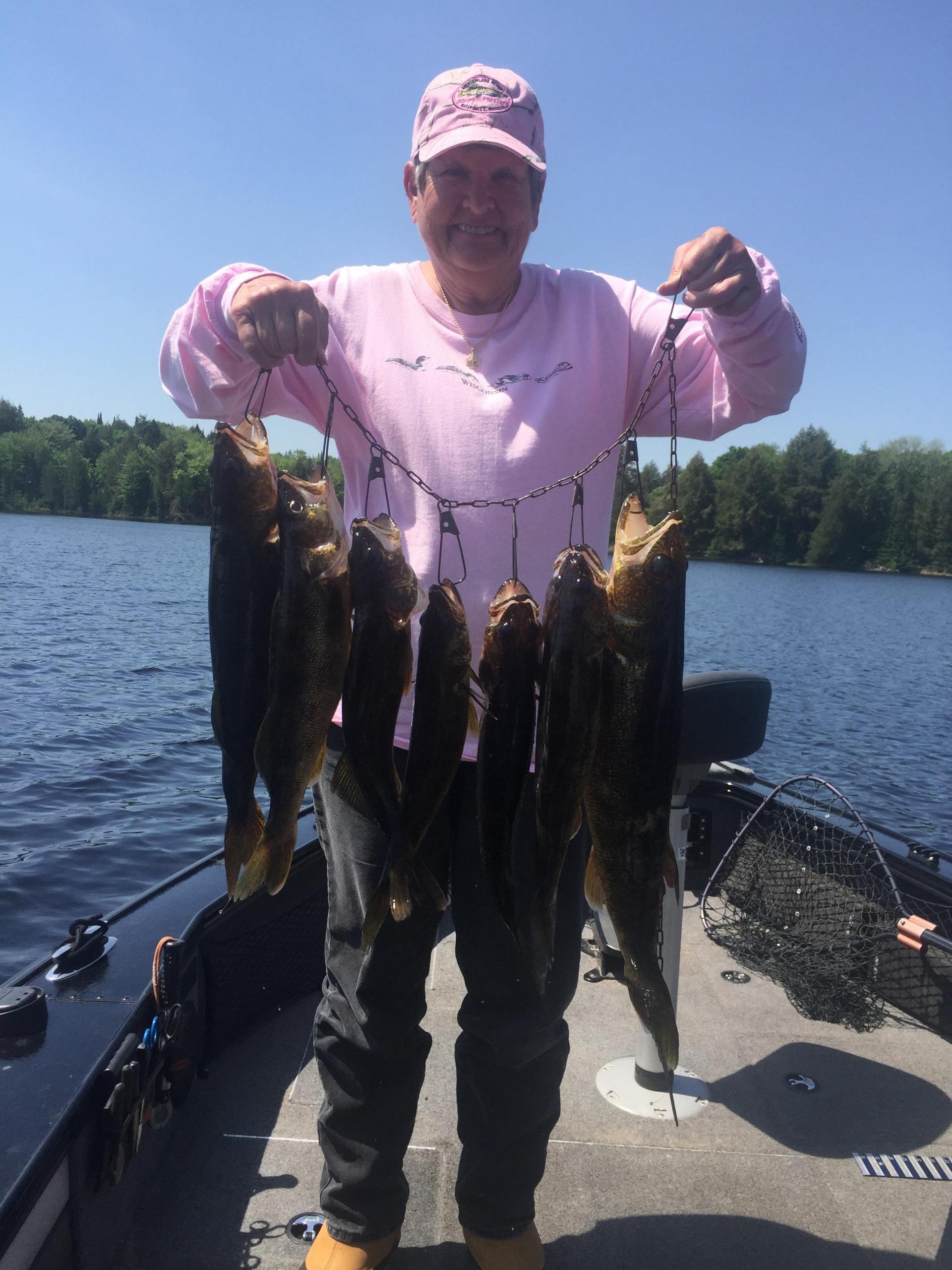 fisherman holding his catch